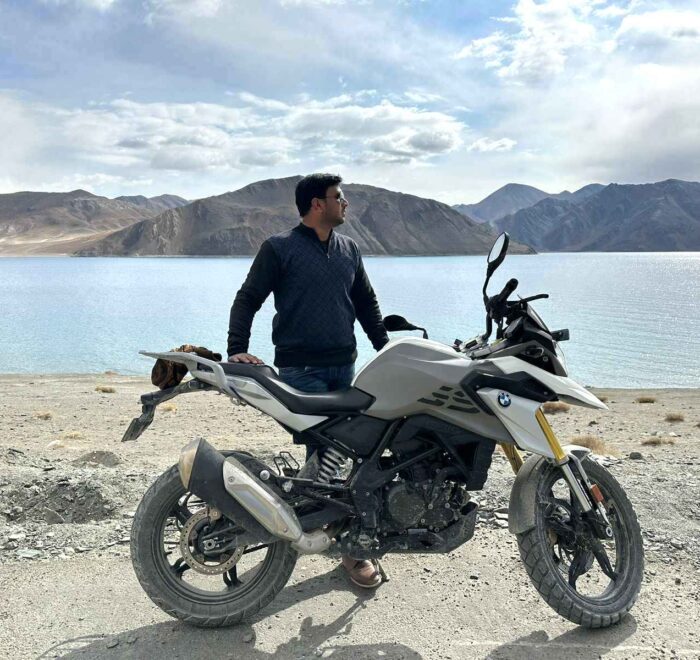BMW motorcycle parked near the scenic Pangong Lake